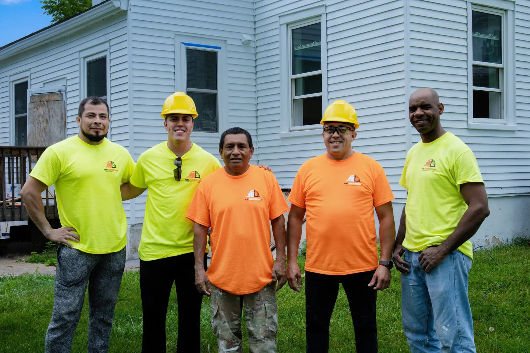 The Vene Construction crew outside a house renovation project