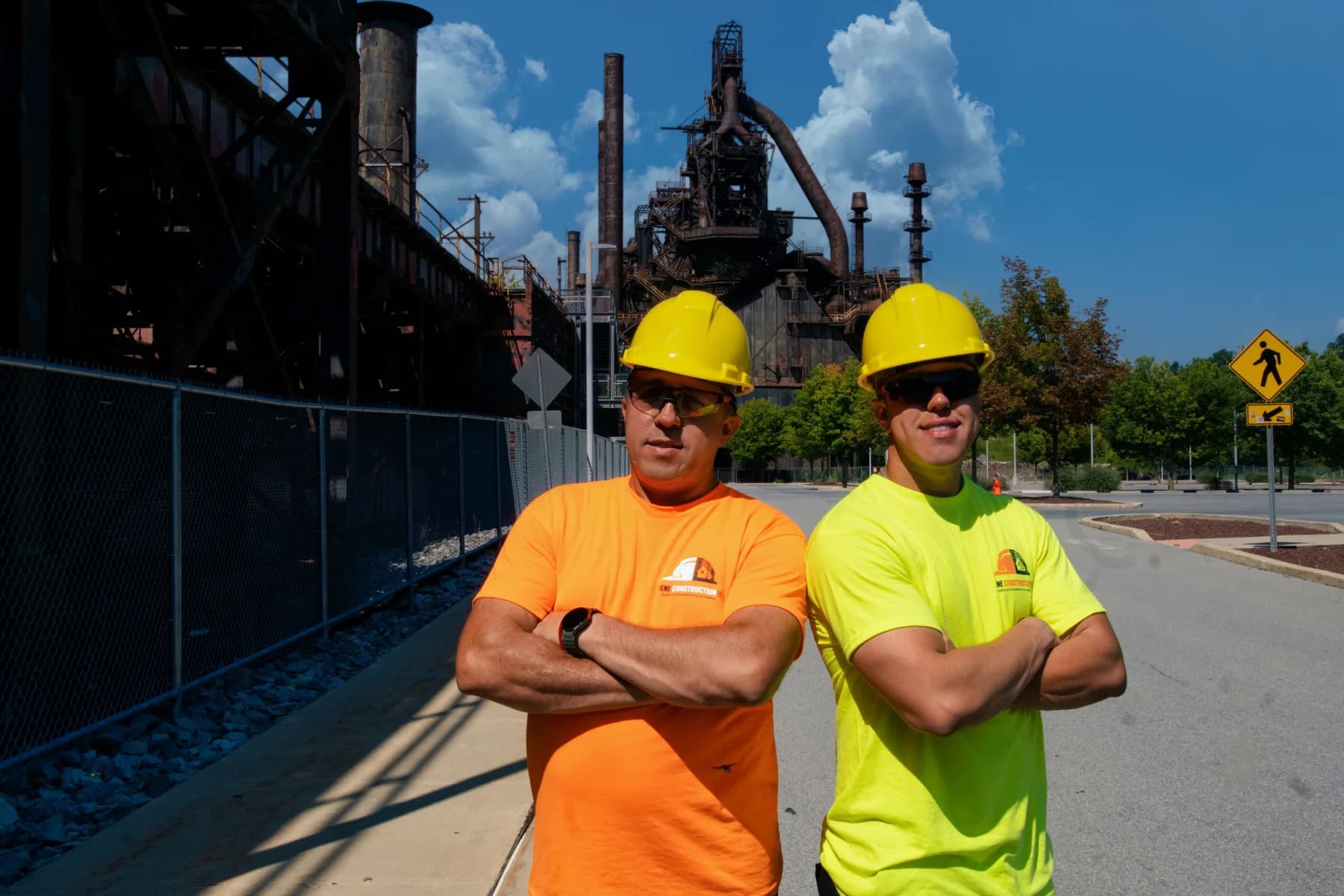 Lorenzo and Yamild Perez of Vene Construction in front of the Bethlehem Steel blast furnaces