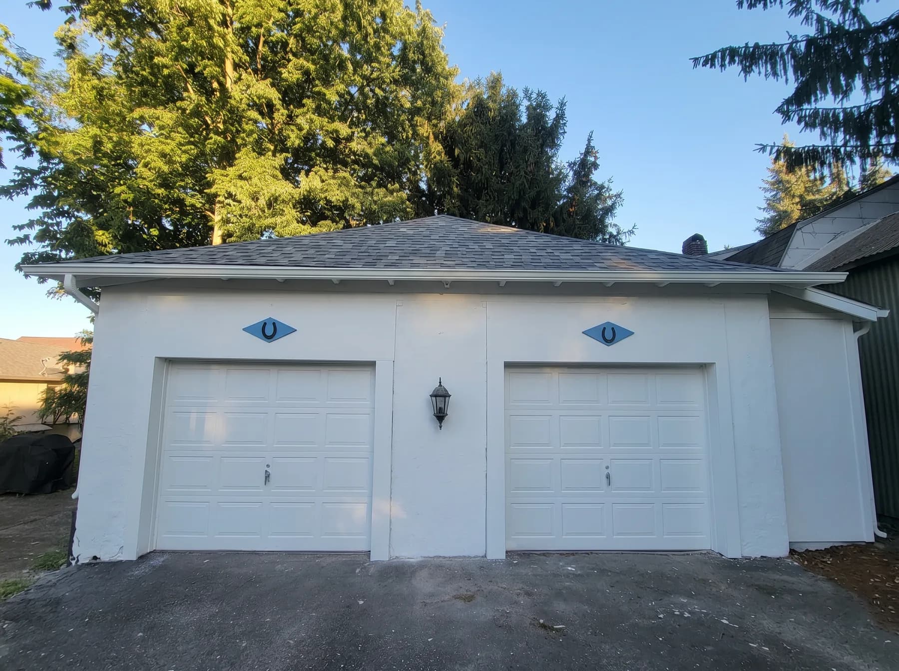 Finished detached garage with white exterior paint and blue accents in Bethlehem PA