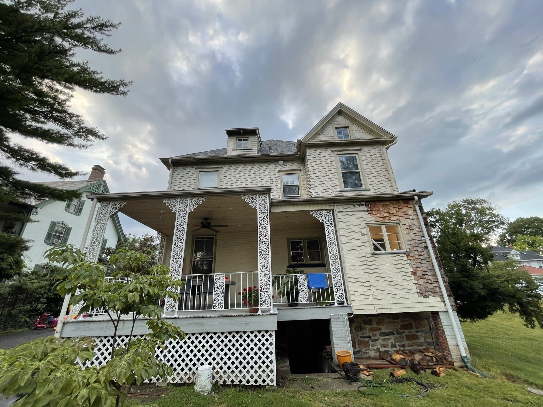 Before photo of rear porch exterior with patchwork siding in Bethlehem PA