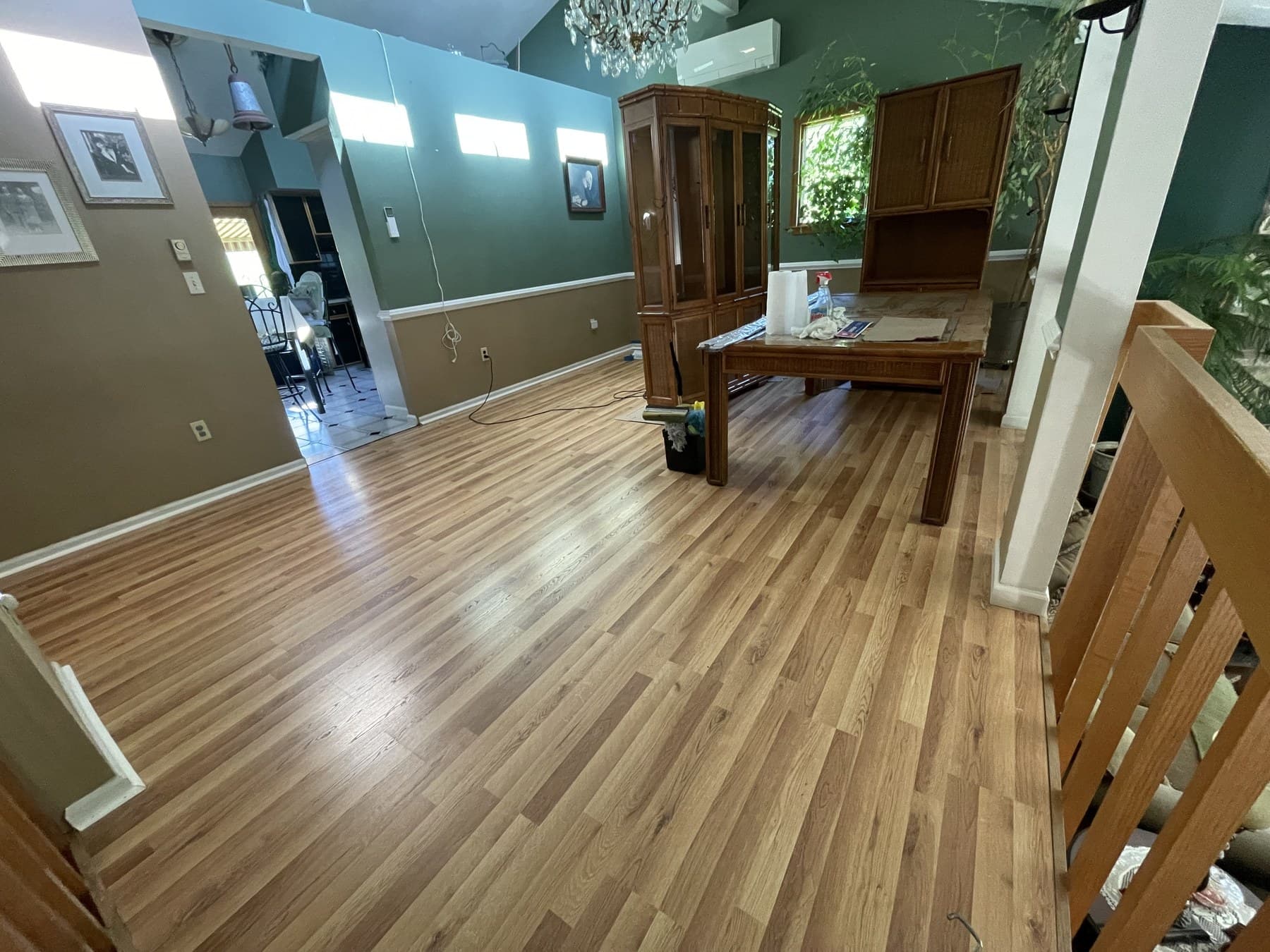 Finished wood-tone plank flooring in a Catasauqua house by Vene Construction