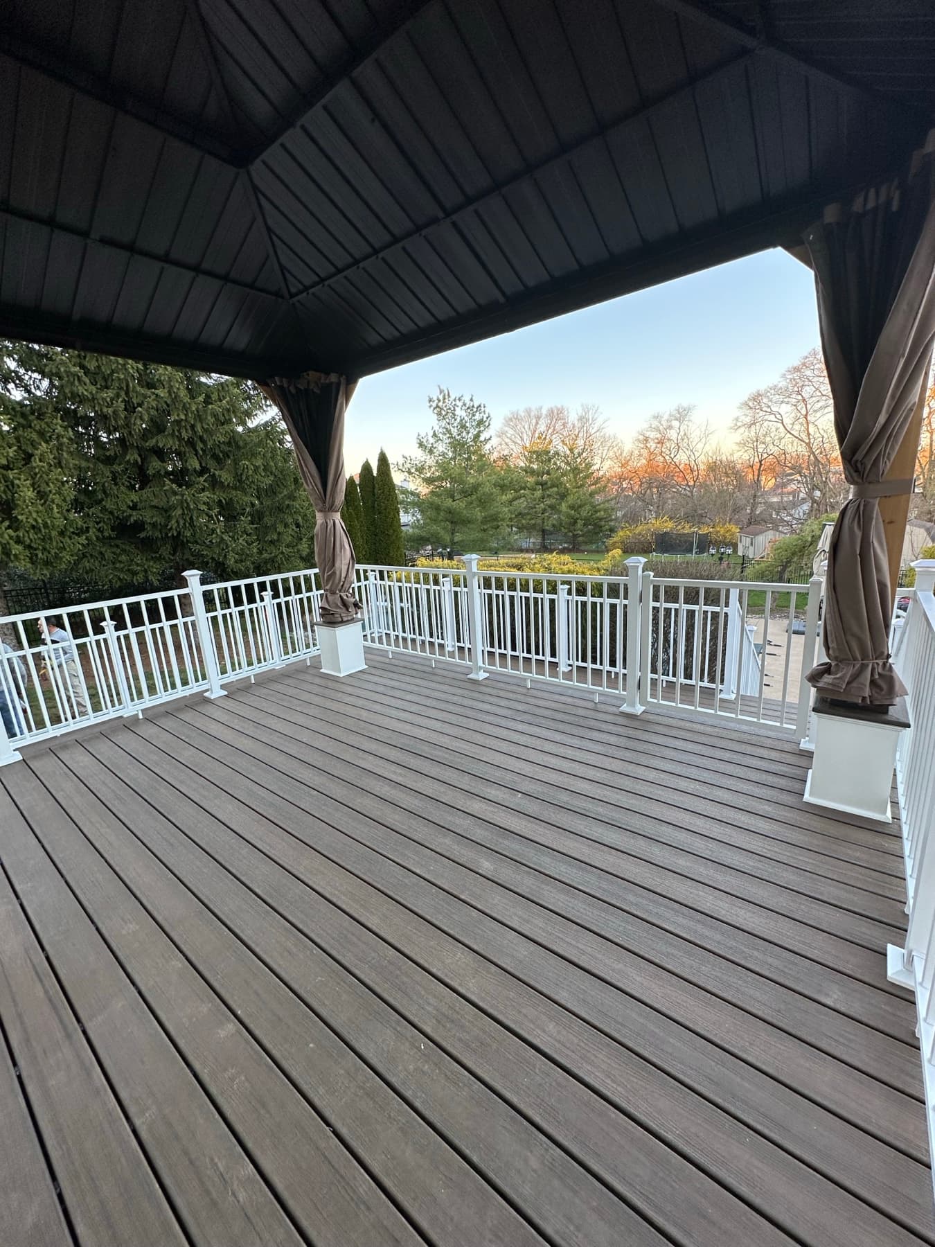 Covered deck area with composite PVC boards and vinyl railings in Easton PA