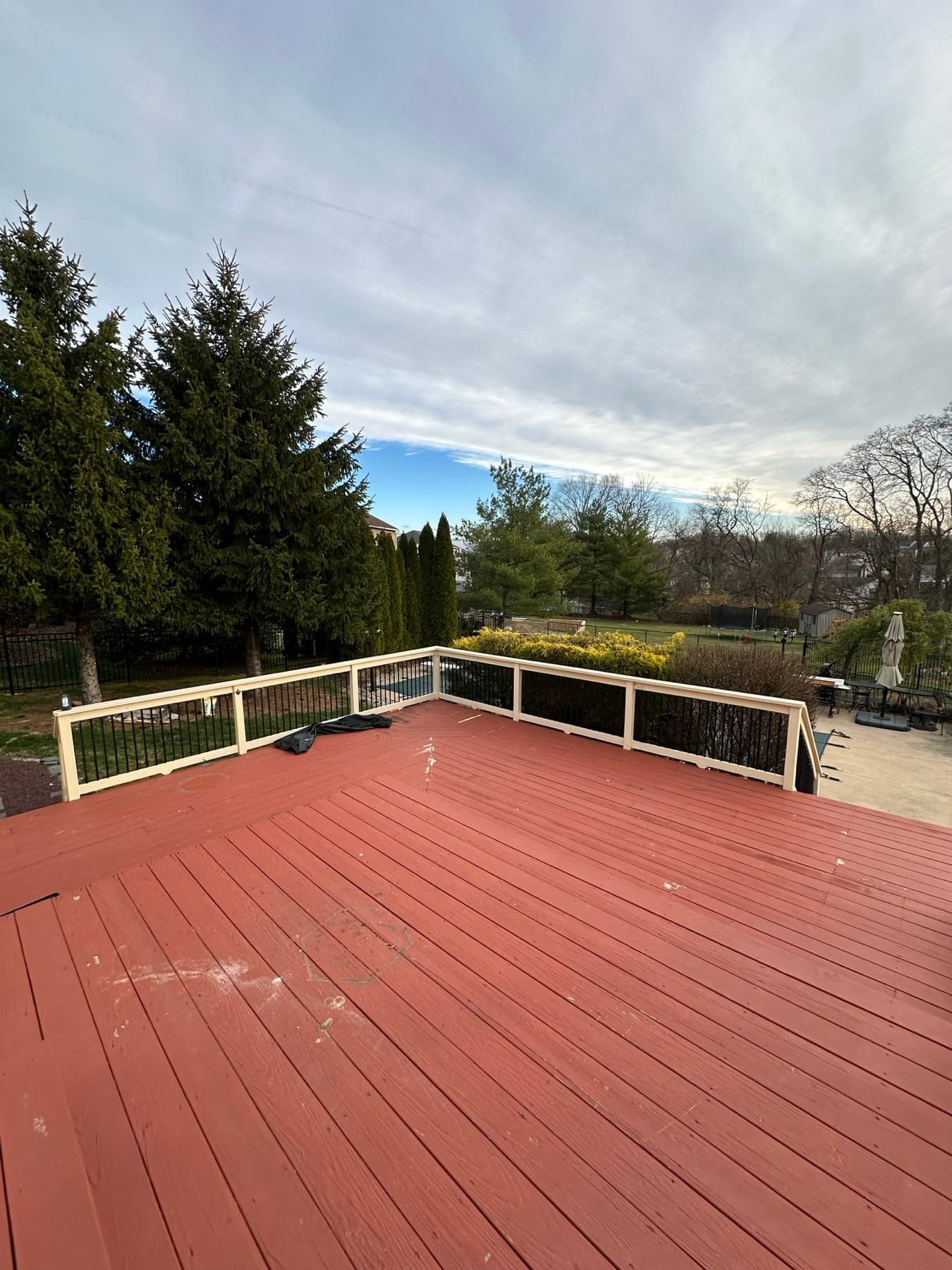 Before photo of red upper deck landing before a deck rebuild in Easton