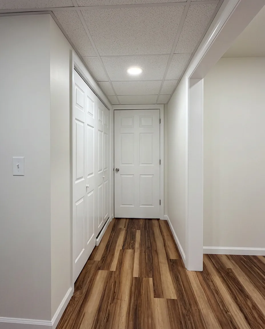 Finished basement hallway with closet storage and LVP flooring in Easton, PA