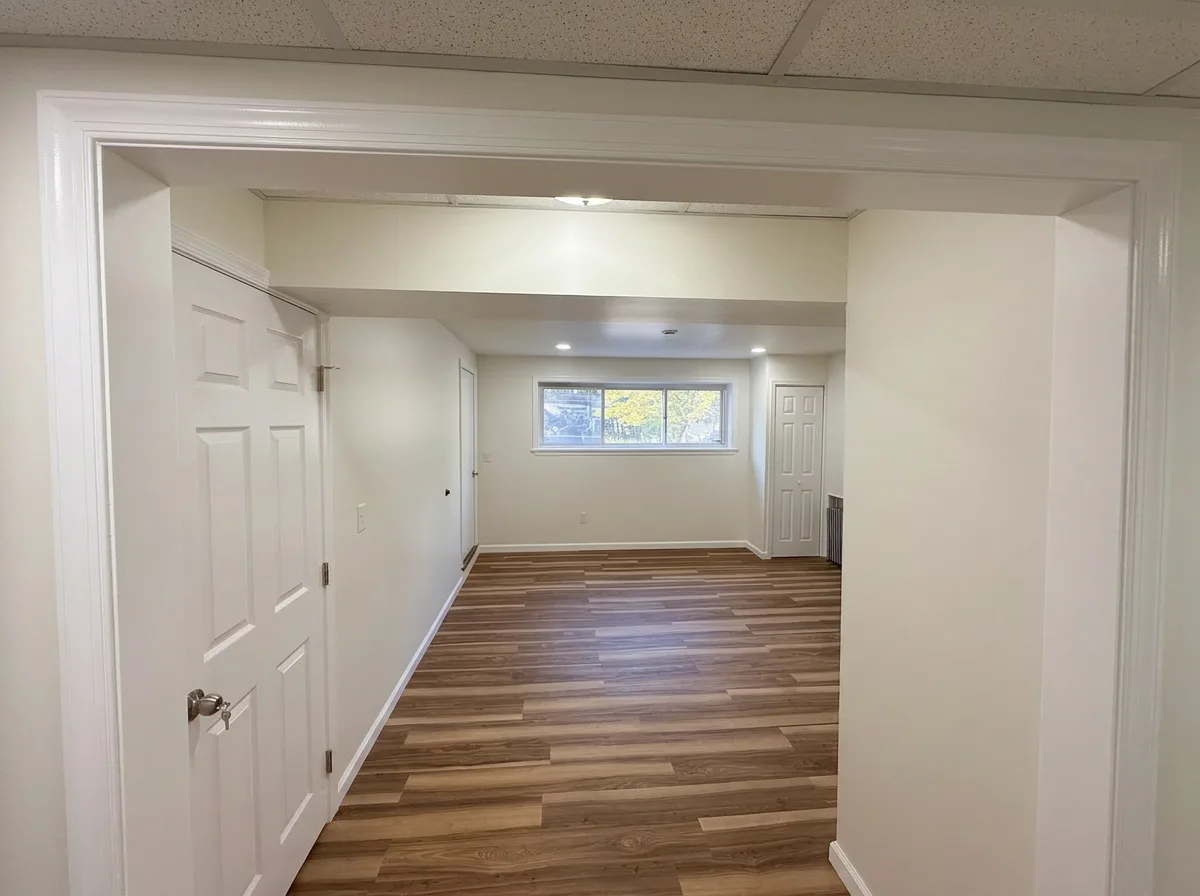 Finished basement back room with a daylight window and LVP flooring in Easton, PA