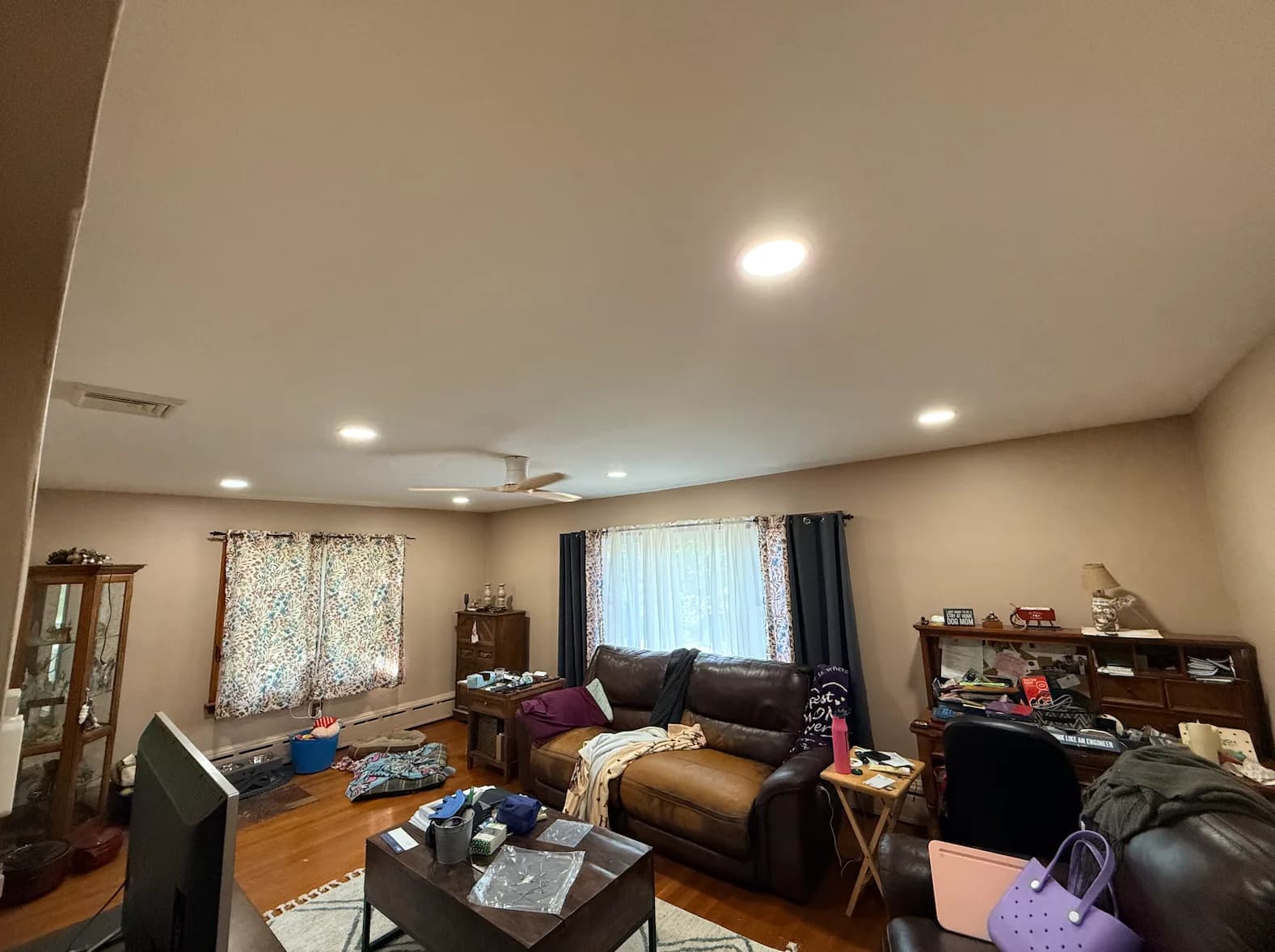 Before photo of a dated basement living room in Easton, PA