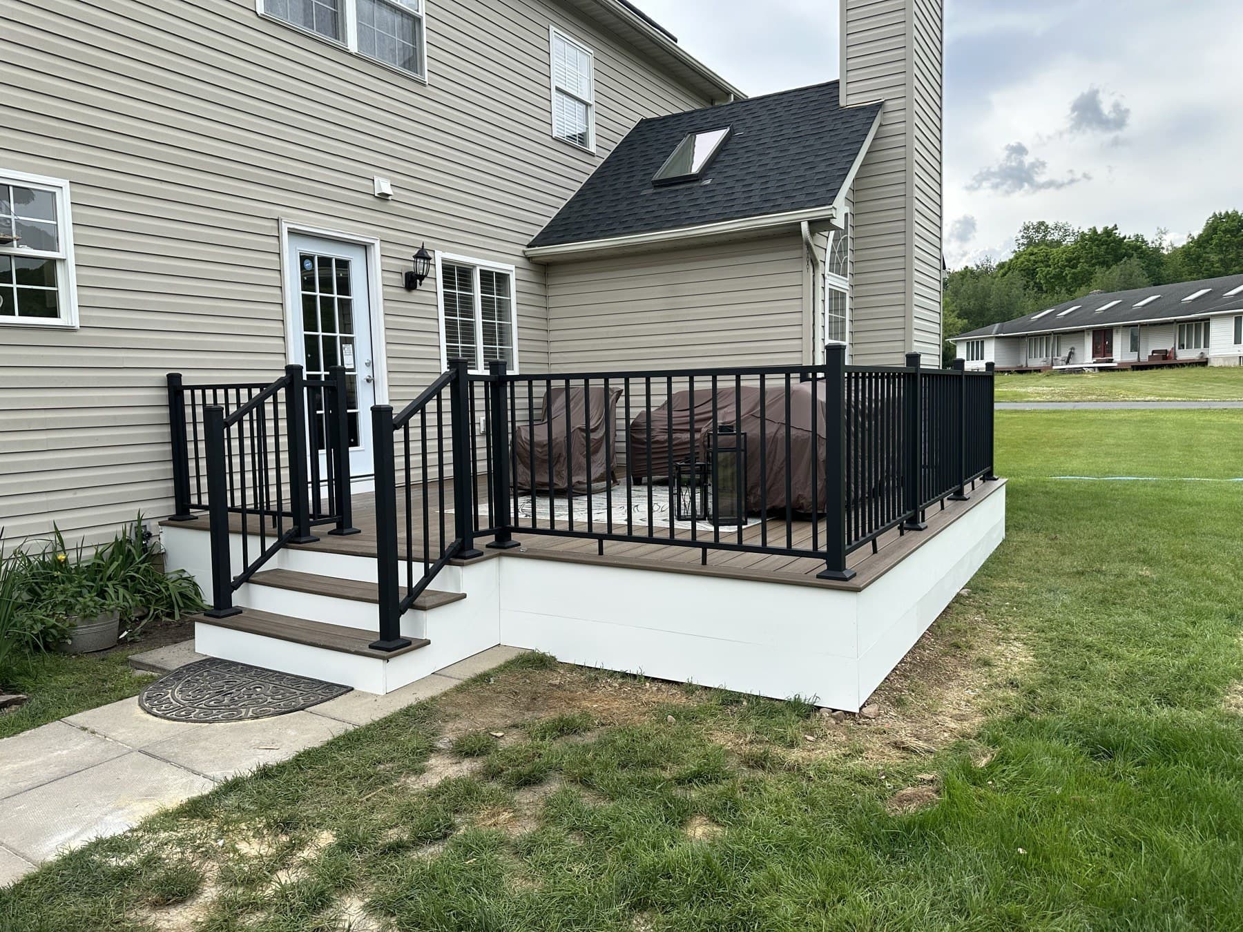 House-side view of finished deck and black railing in Emmaus PA