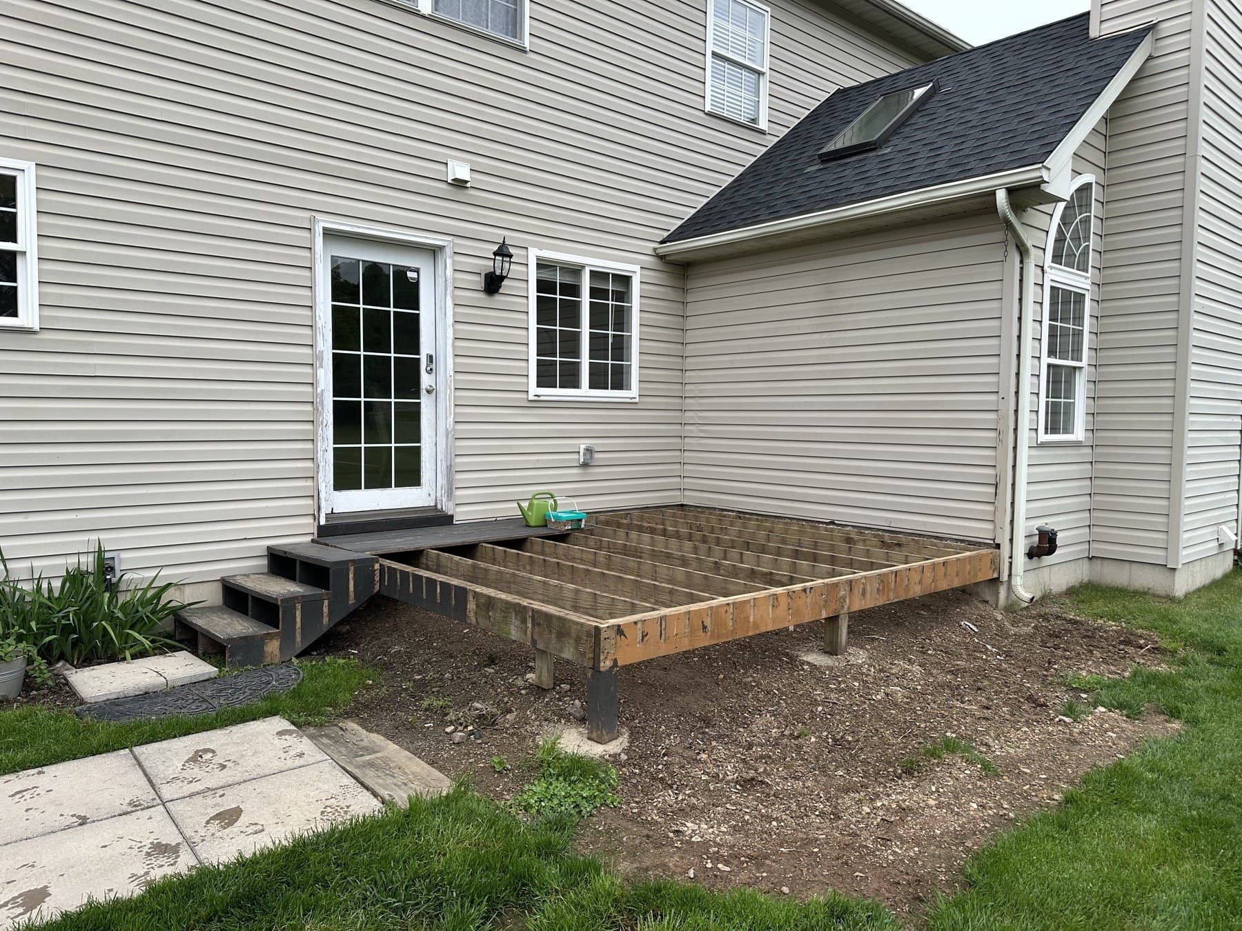 Deck platform framing during a backyard deck build in Emmaus PA