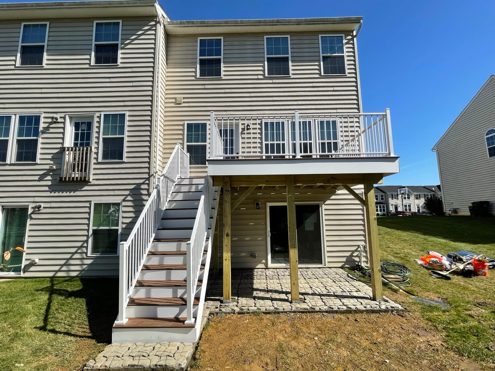 Finished elevated deck and stair build with white railing in Macungie PA
