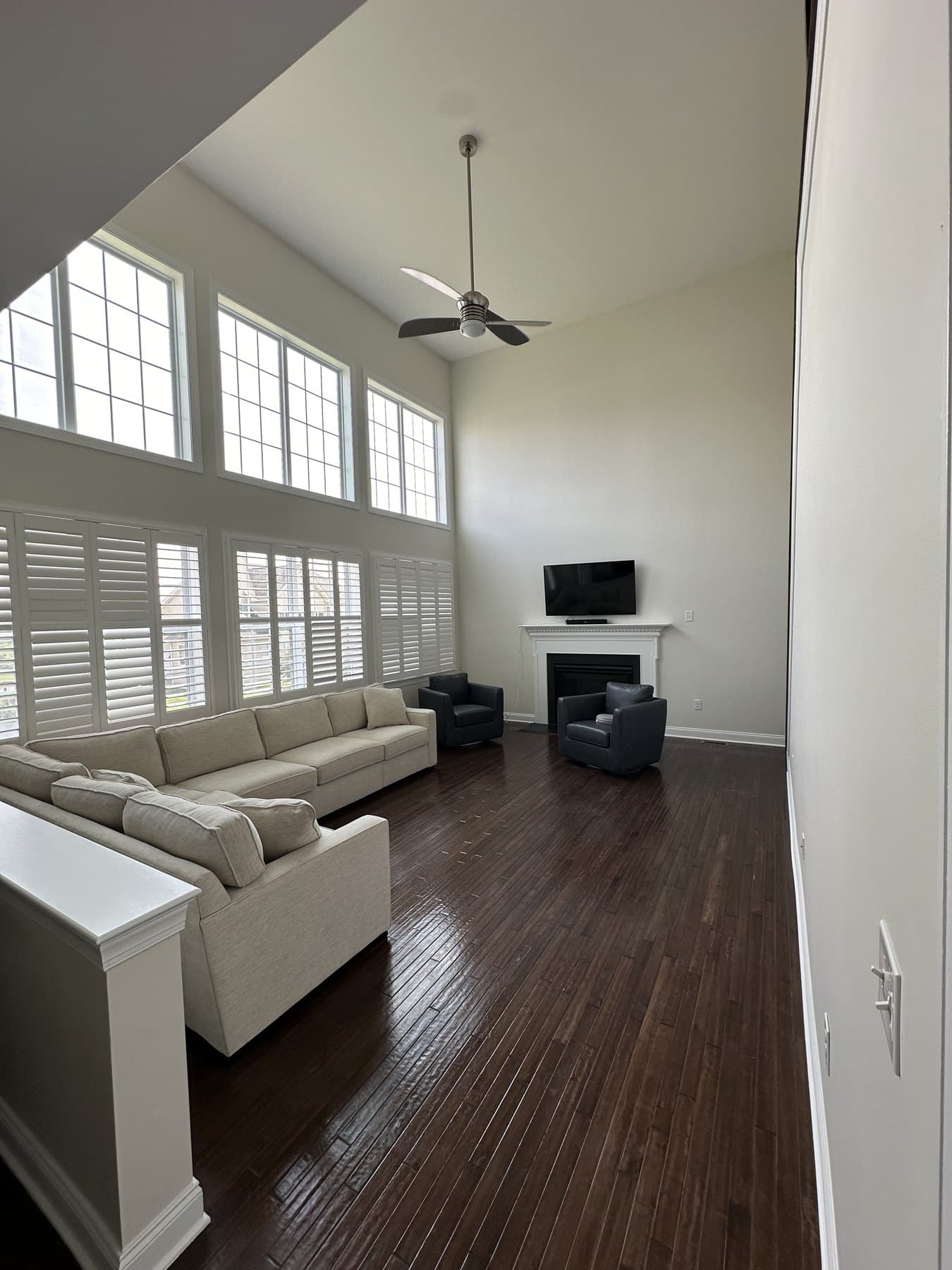 Finished two-story living room after an interior painting and trim refresh in Macungie PA