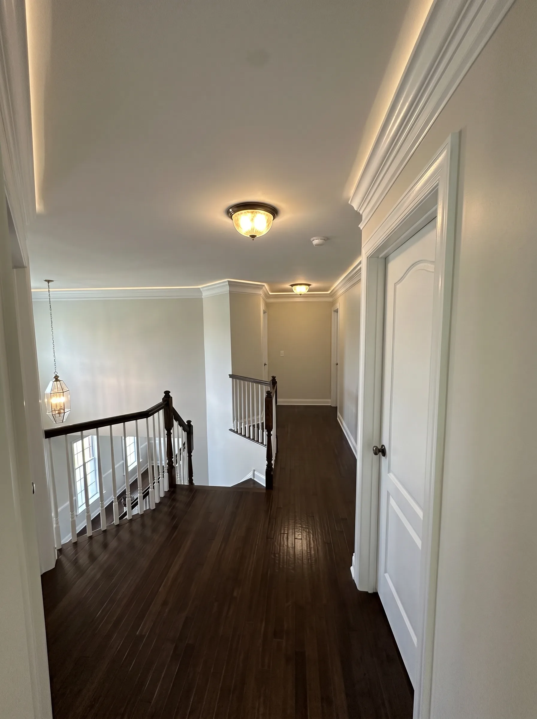 Upstairs hall and stair railing after interior painting in a Macungie house
