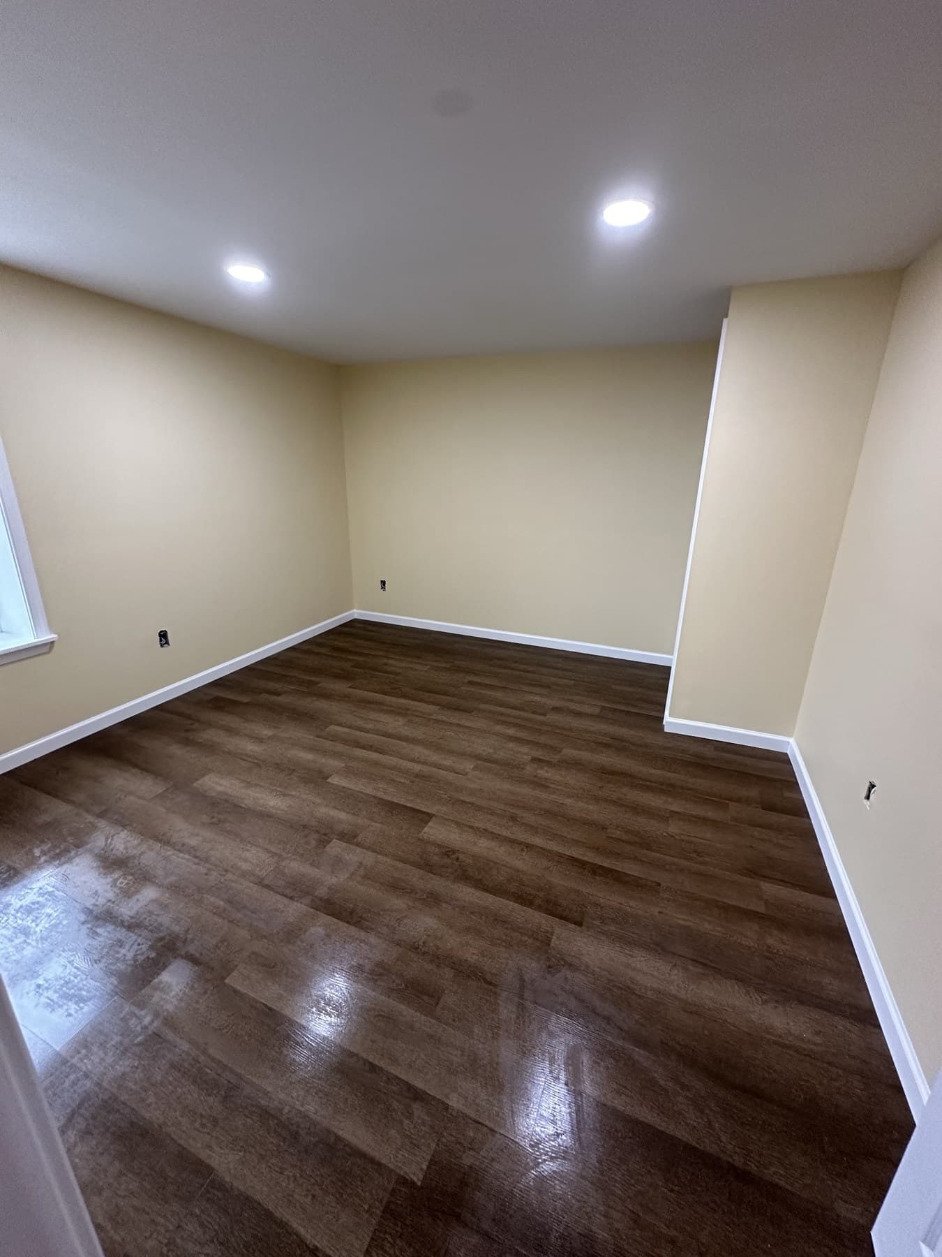 Finished bedroom with paint and wood look flooring in Slatington PA