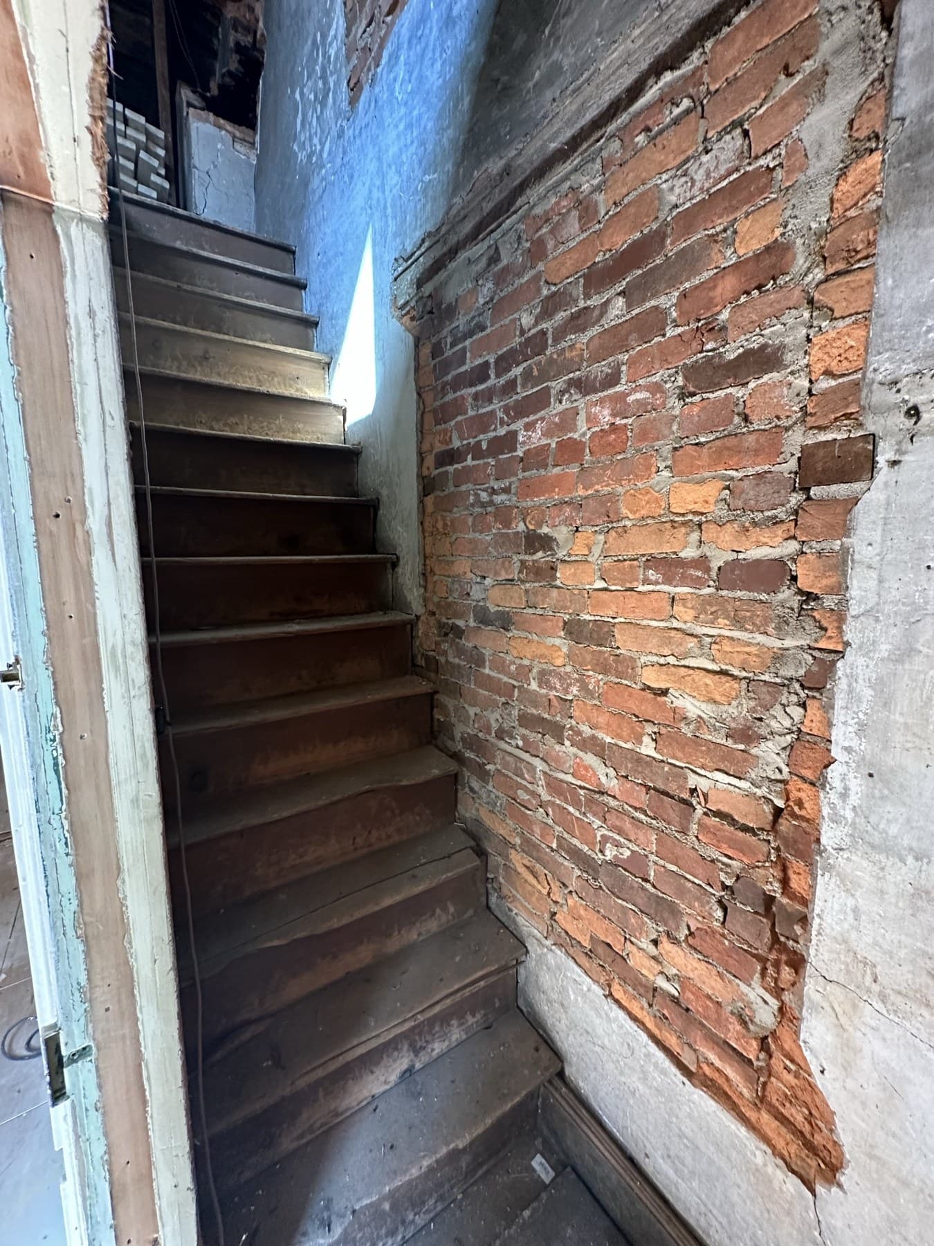 Stair area with exposed brick during a Slatington interior renovation