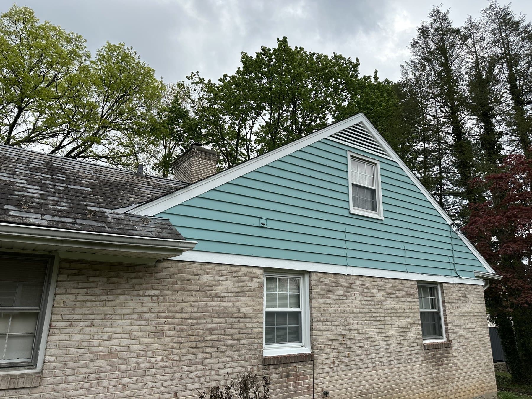 Finished side elevation with painted siding and brick exterior near Allentown PA