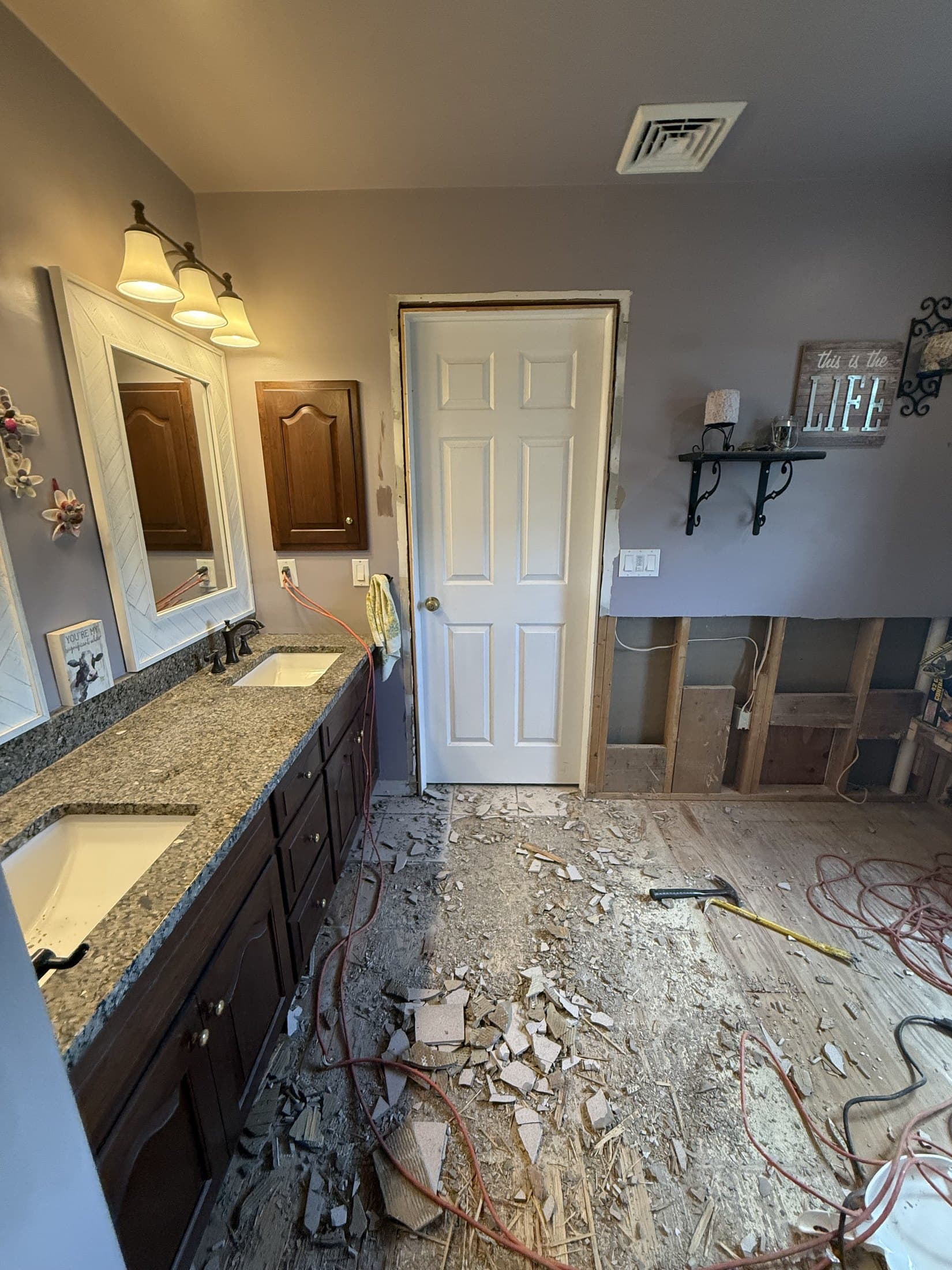 Vanity wall and bathroom floor removal during West End Allentown remodel