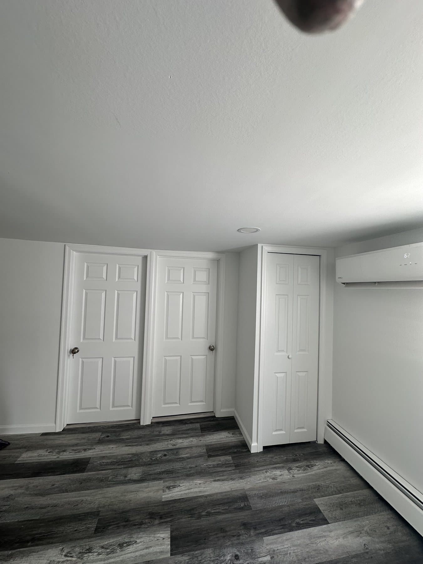 Finished bedroom with closet doors and LVP flooring in Westgate Hills Bethlehem