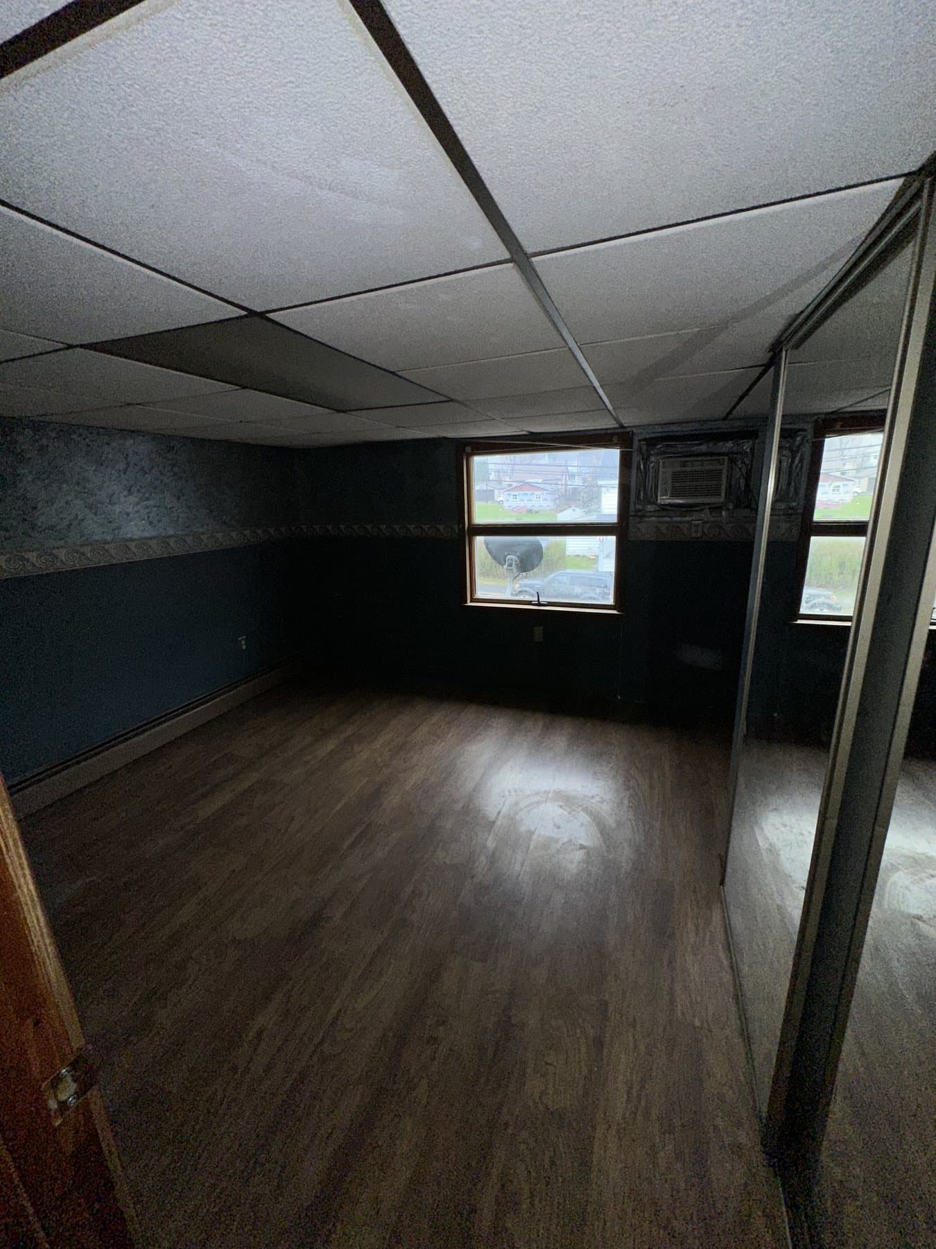 Before photo of main room with drop ceiling and older finishes in Bethlehem
