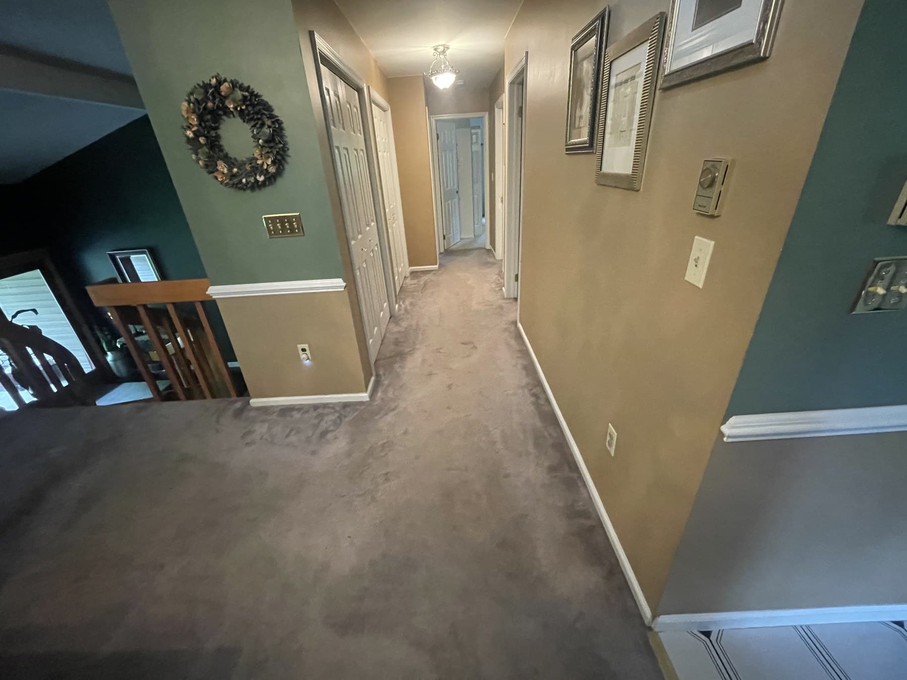 Before photo of carpeted hallway before flooring work in Catasauqua PA
