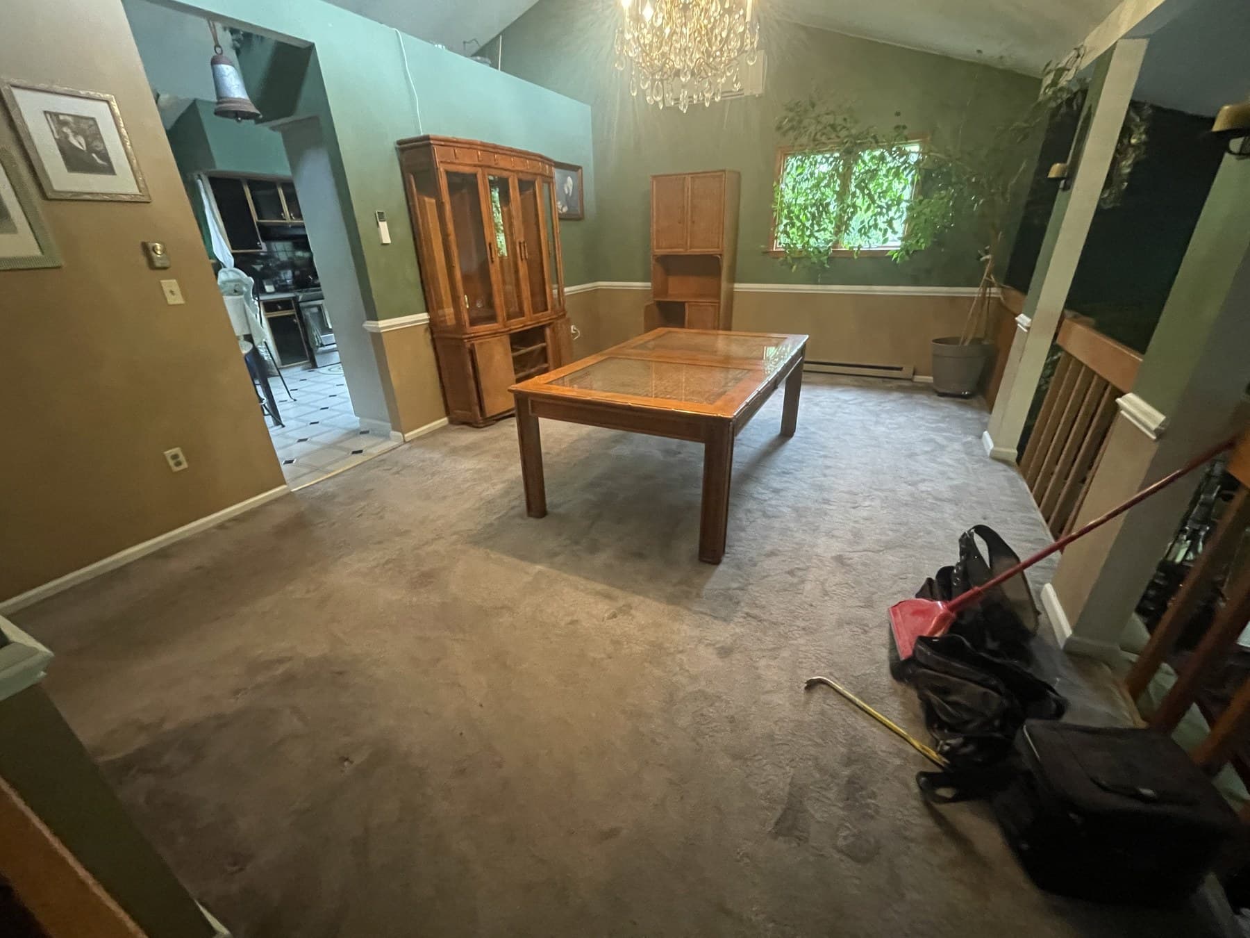 Before photo of carpeted living and dining room before flooring update in Catasauqua