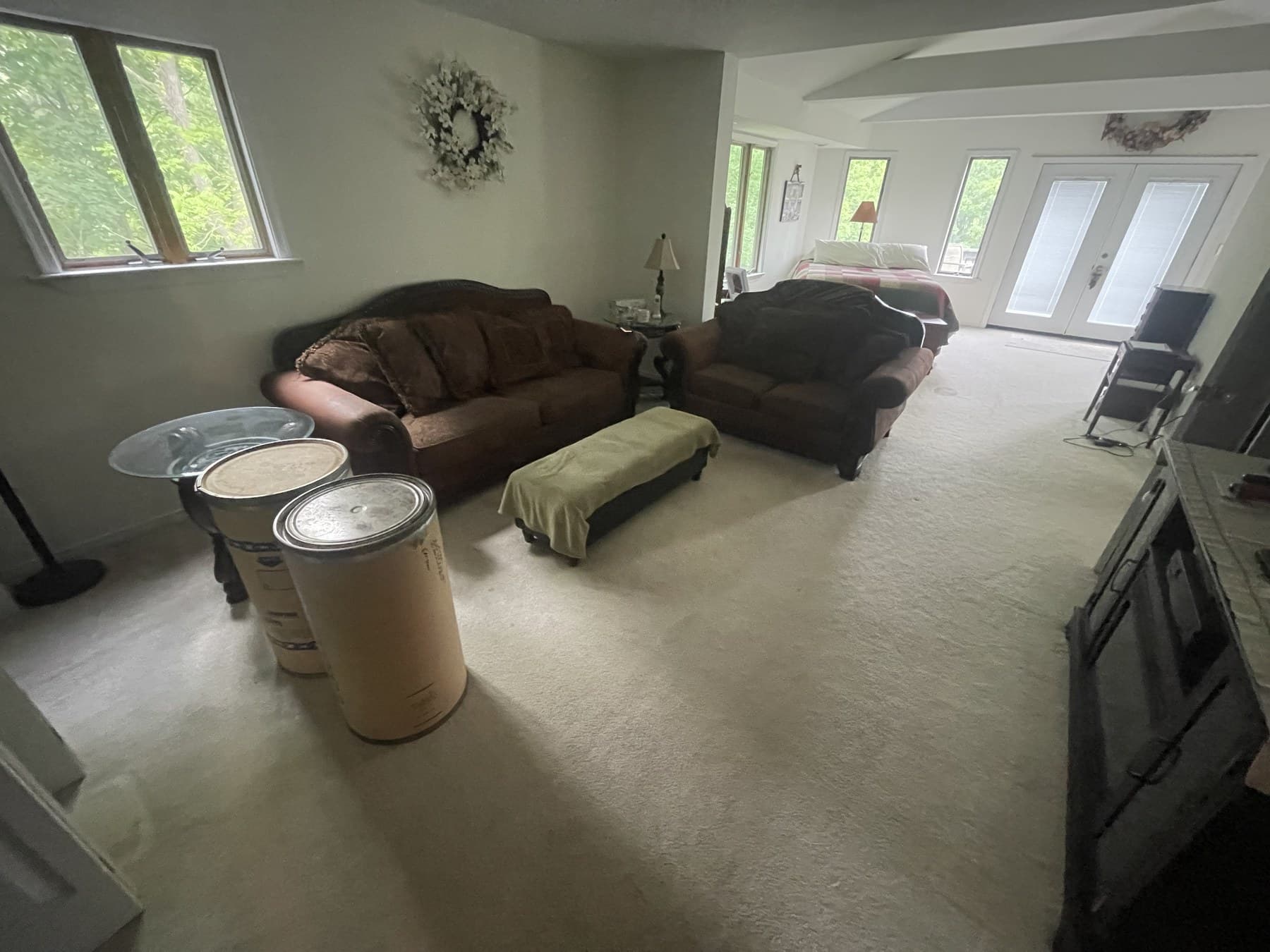 Before photo of carpeted living room with windows before flooring update in Catasauqua