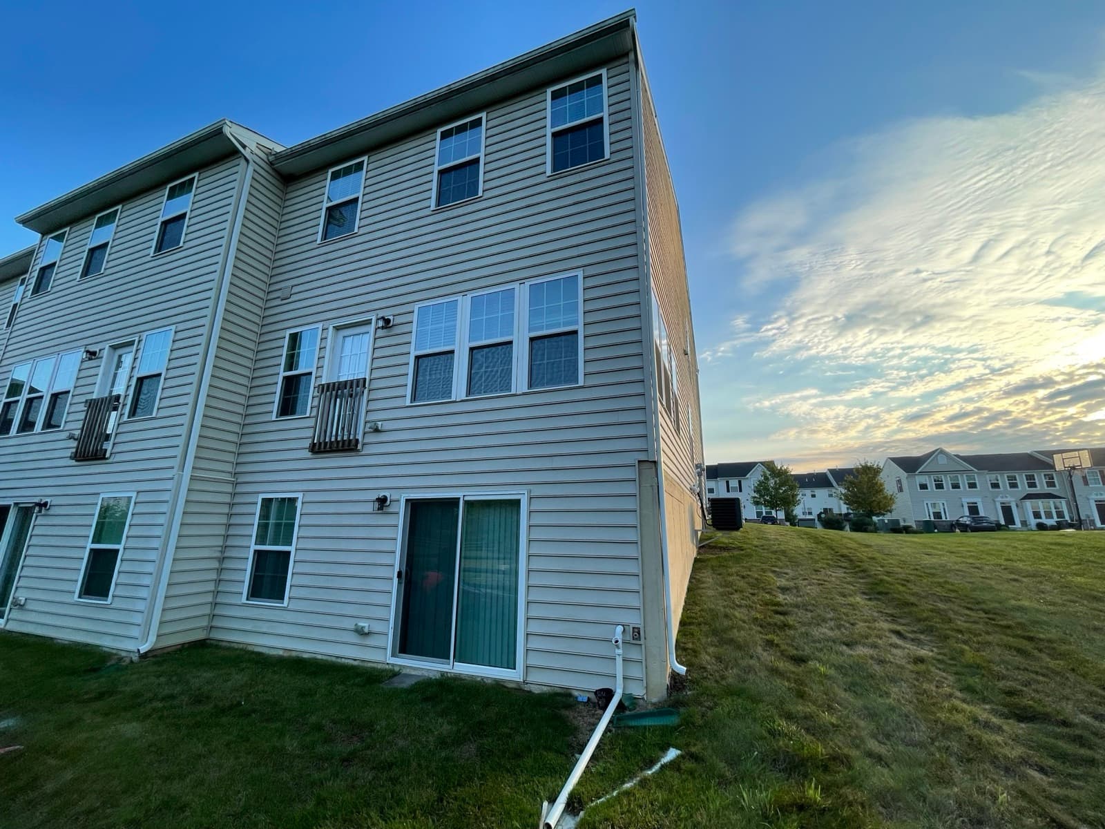 Before photo of rear house elevation before an elevated deck build in Macungie PA