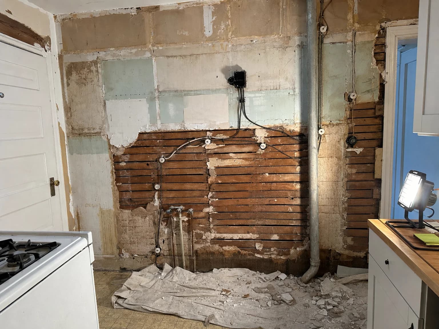 Old knob-and-tube wiring exposed during a kitchen remodel in Allentown, PA by Vene Construction