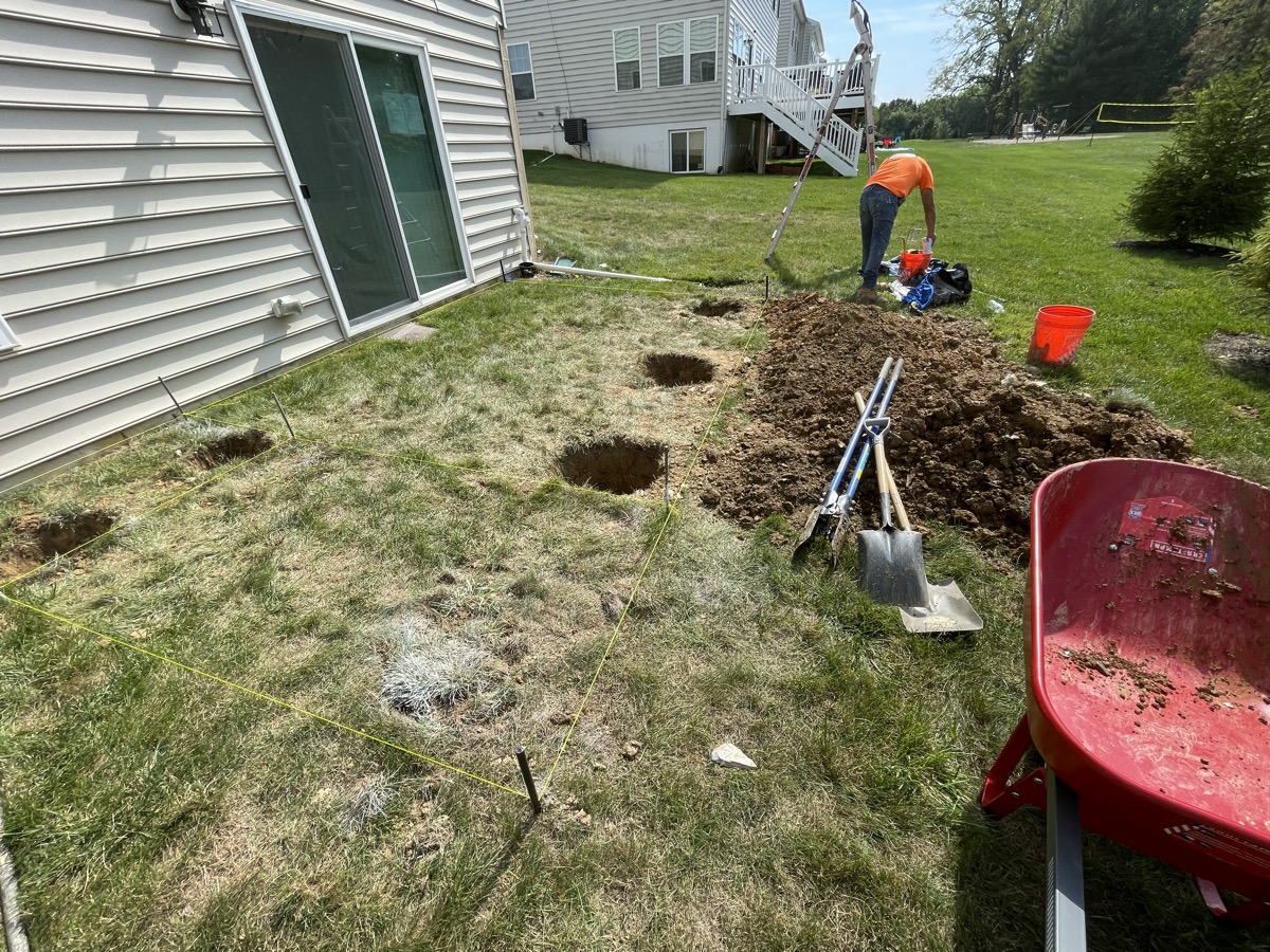 Backyard footing layout before a rear deck build