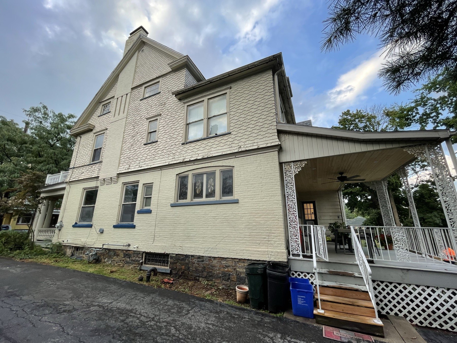 Before photo of side porch and weathered exterior paint in Bethlehem PA
