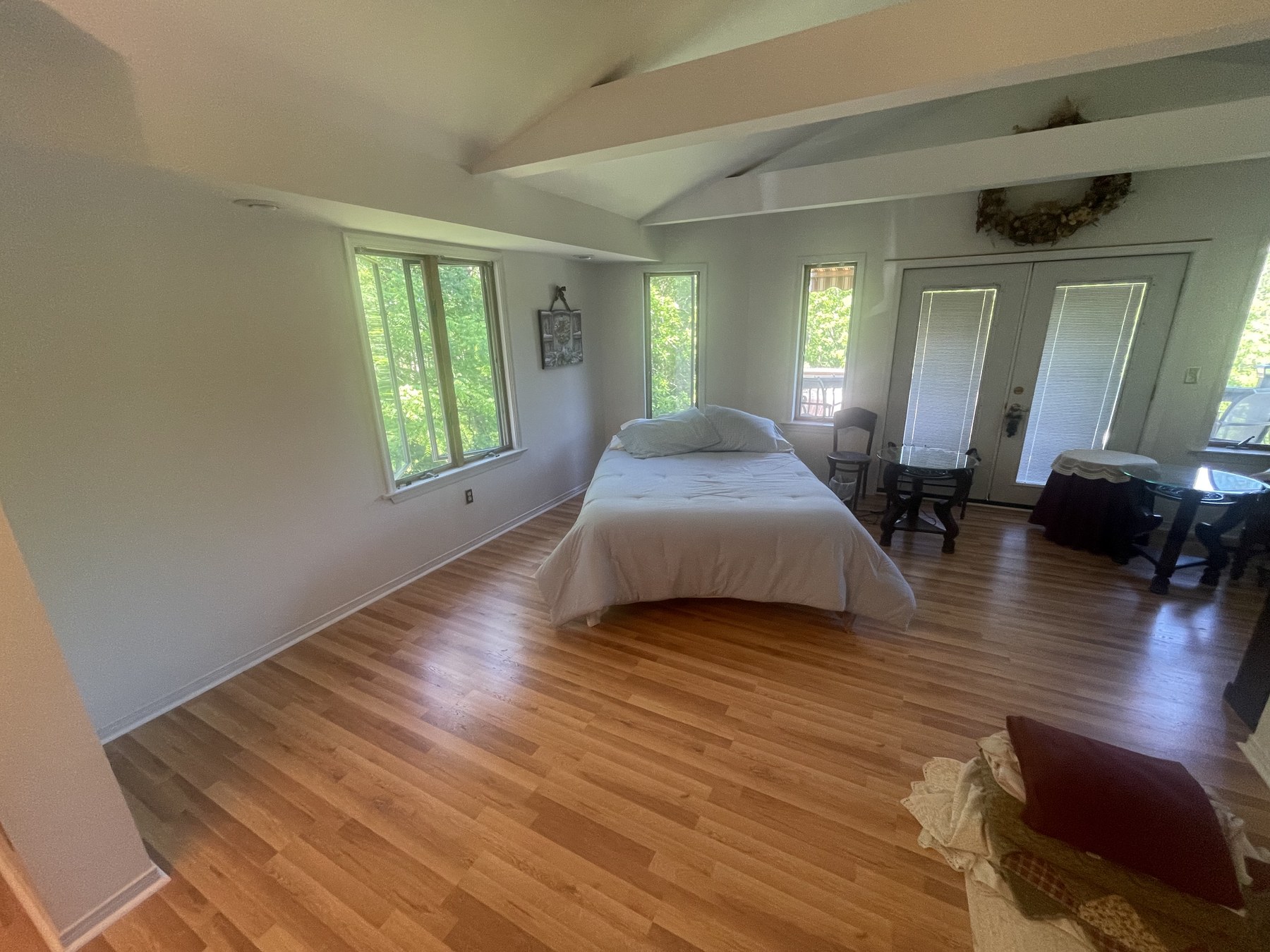 Wide finished bedroom view with wood-tone plank flooring in Catasauqua PA