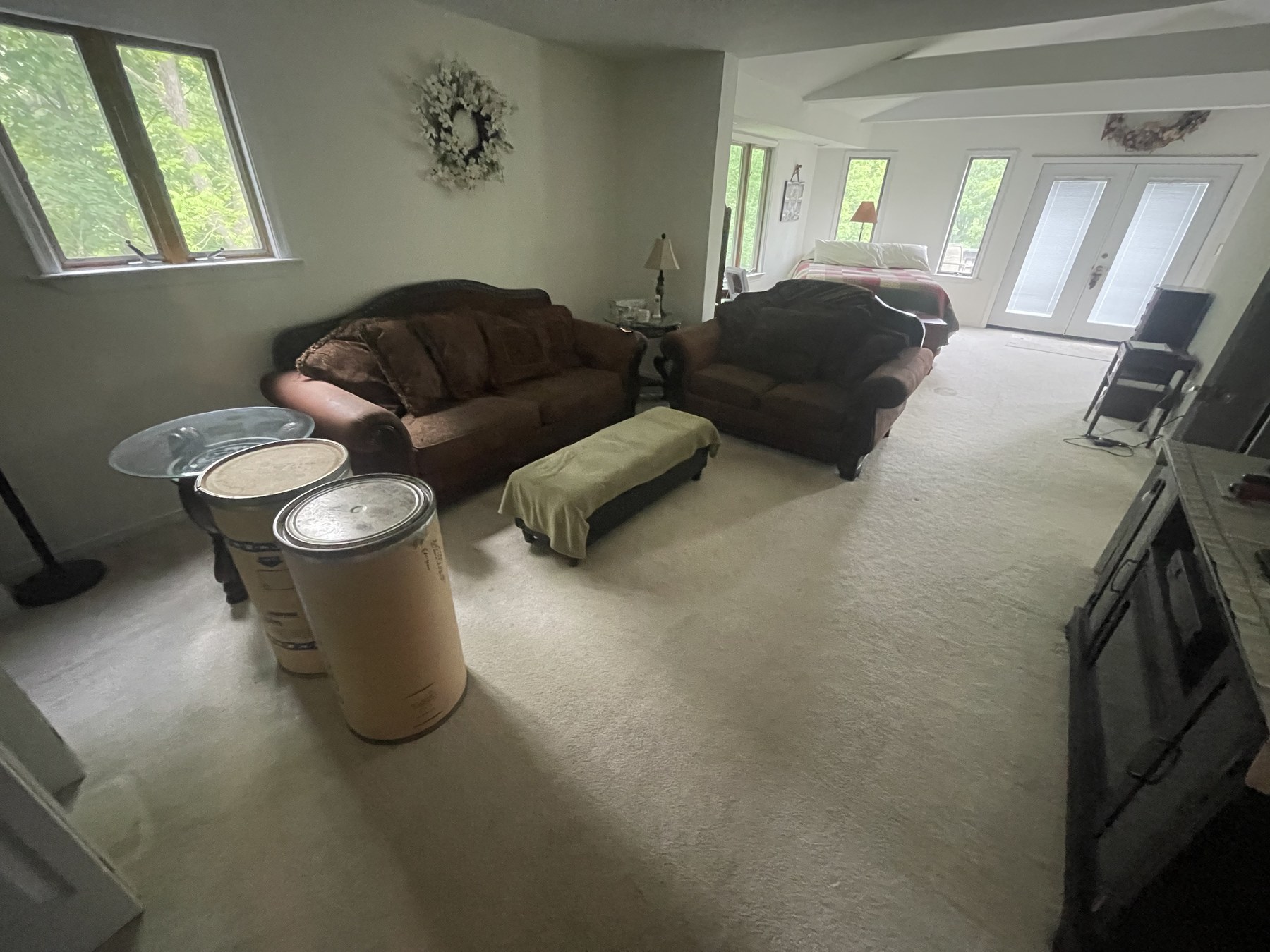 Before photo of carpeted living room with windows before flooring update in Catasauqua
