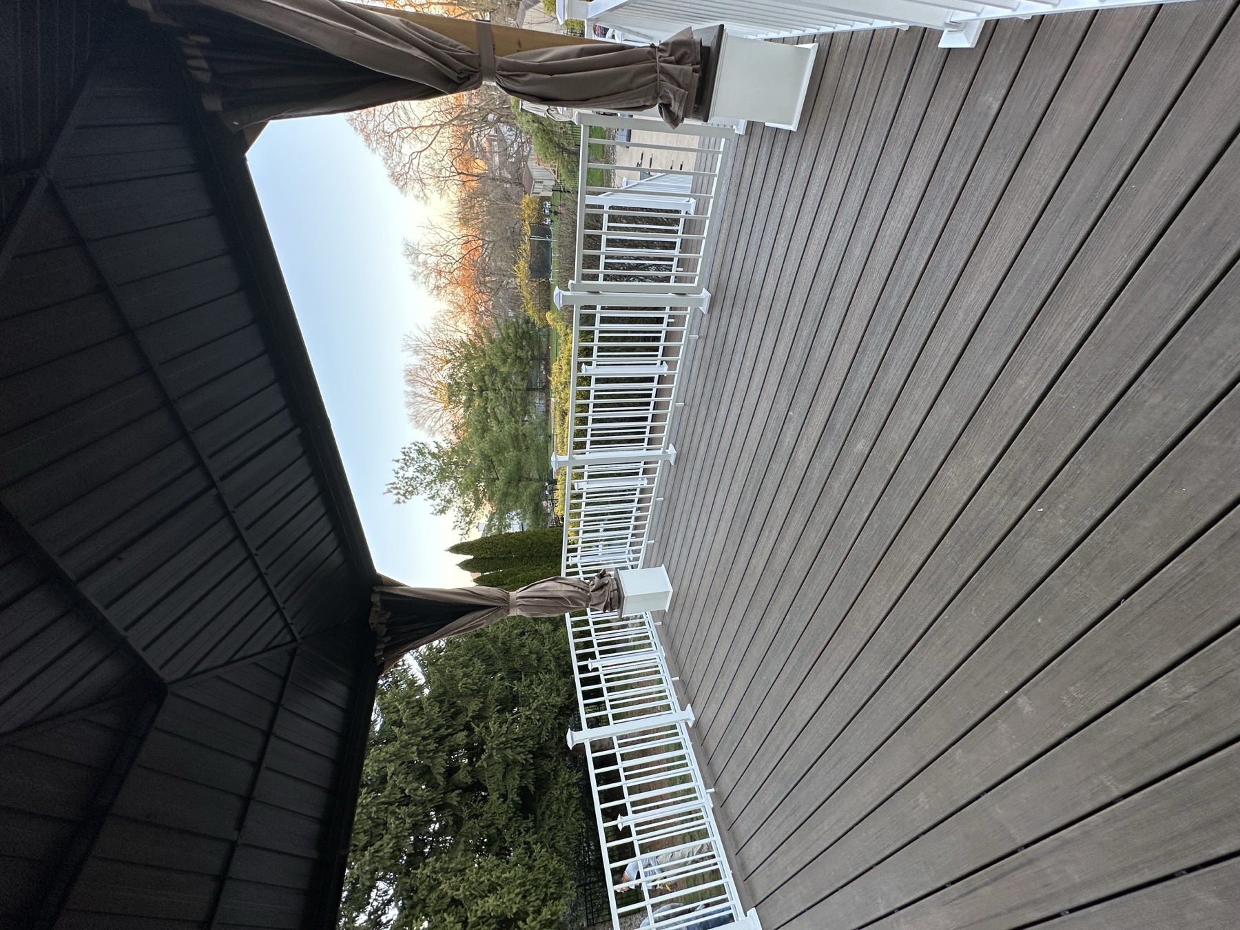 Covered deck area with composite PVC boards and vinyl railings in Easton PA