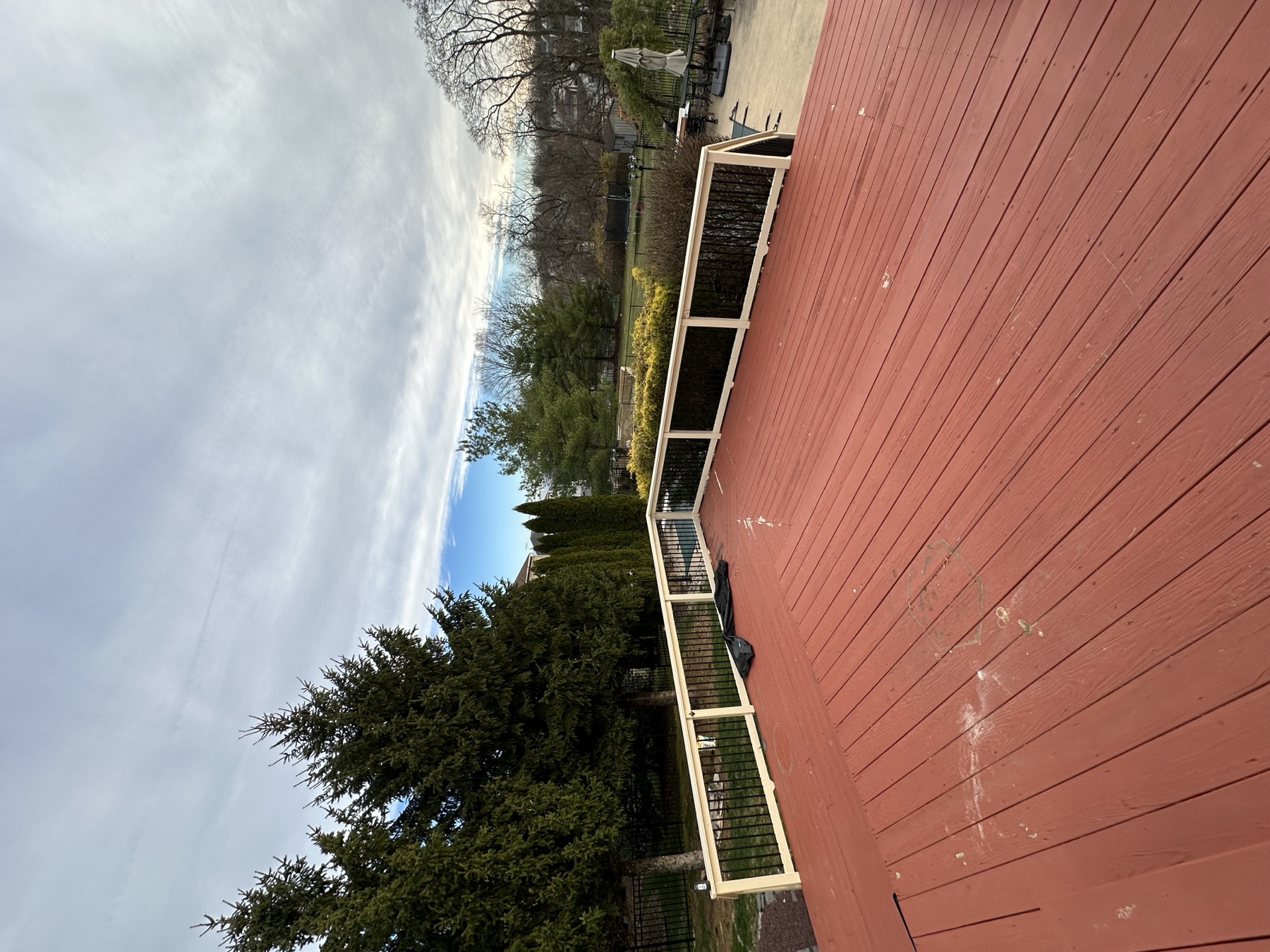 Before photo of red upper deck landing before a deck rebuild in Easton