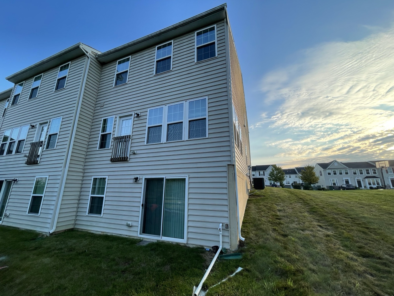 Before photo of rear house elevation before an elevated deck build in Macungie PA