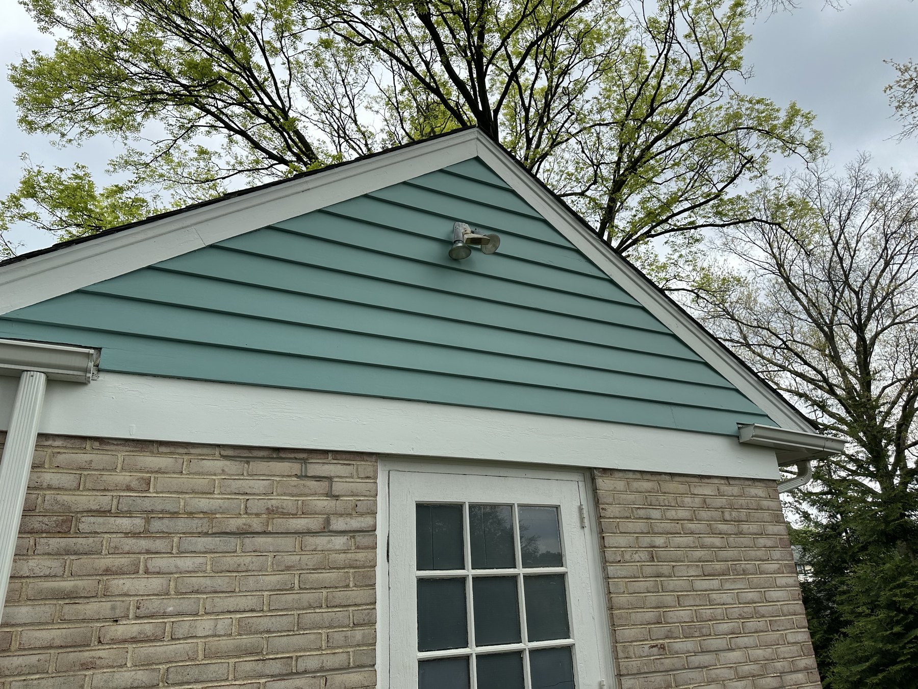 Finished garage gable detail after exterior painting in Allentown PA