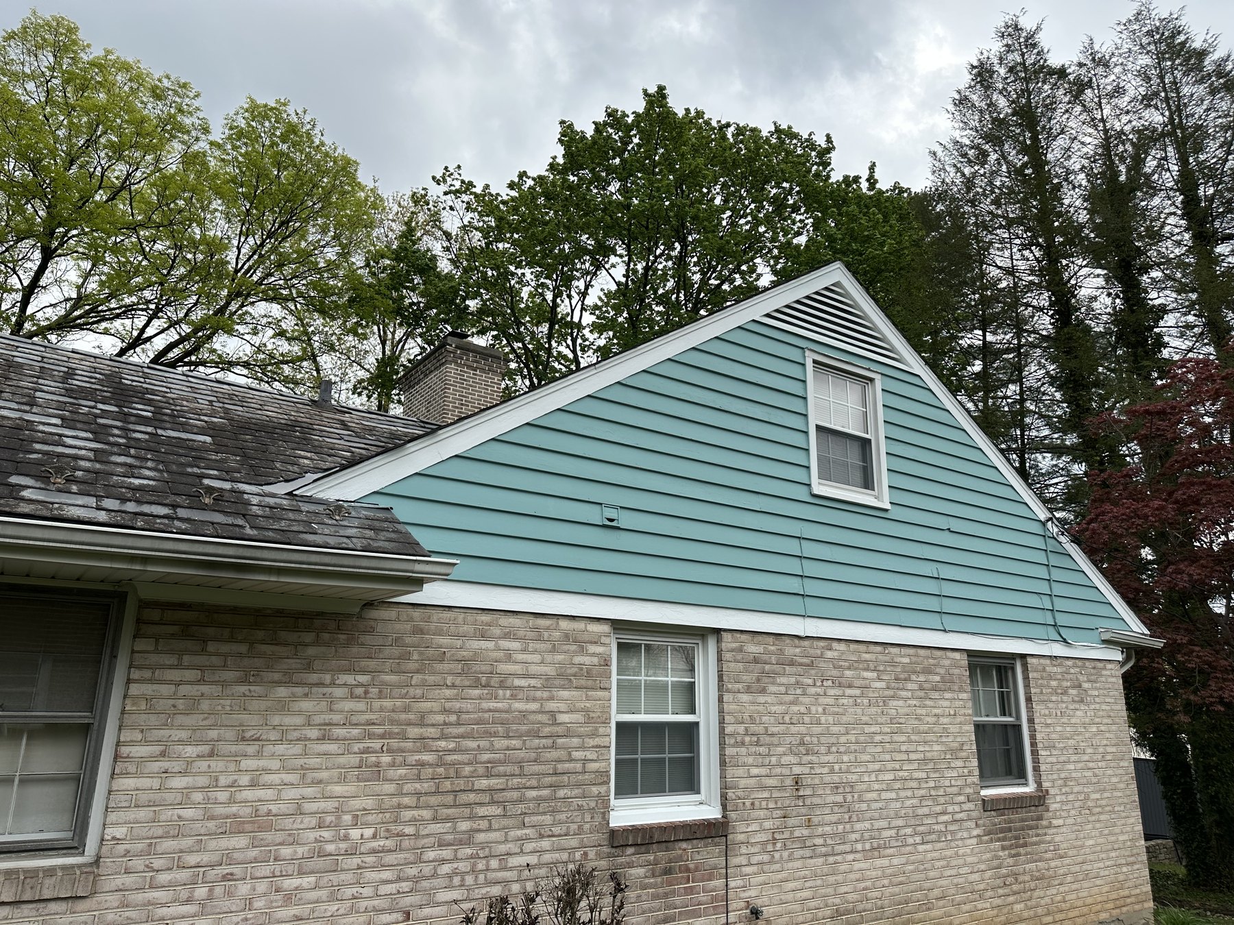 Finished side elevation with painted siding and brick exterior near Allentown PA
