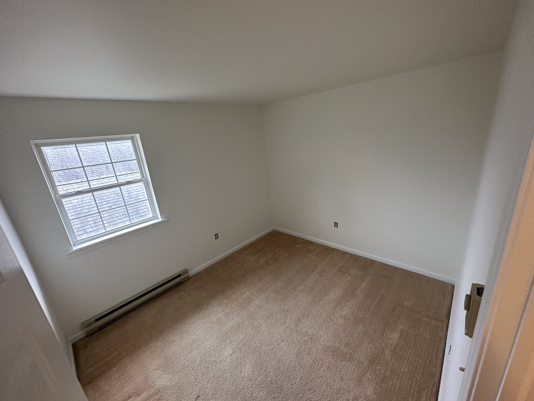 Finished room with neutral paint and white trim after Southside Allentown renovation