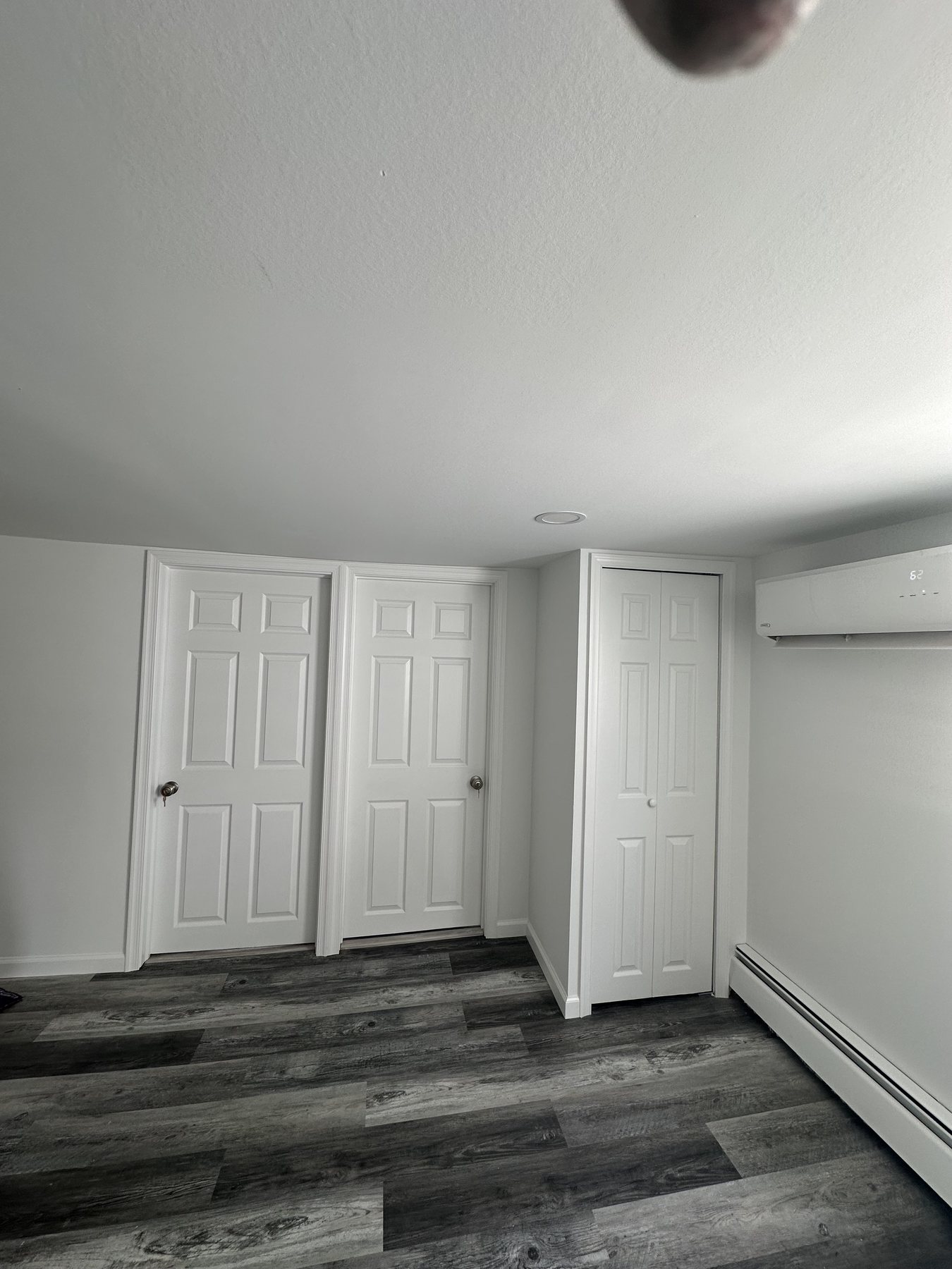Finished bedroom with closet doors and LVP flooring in Westgate Hills Bethlehem