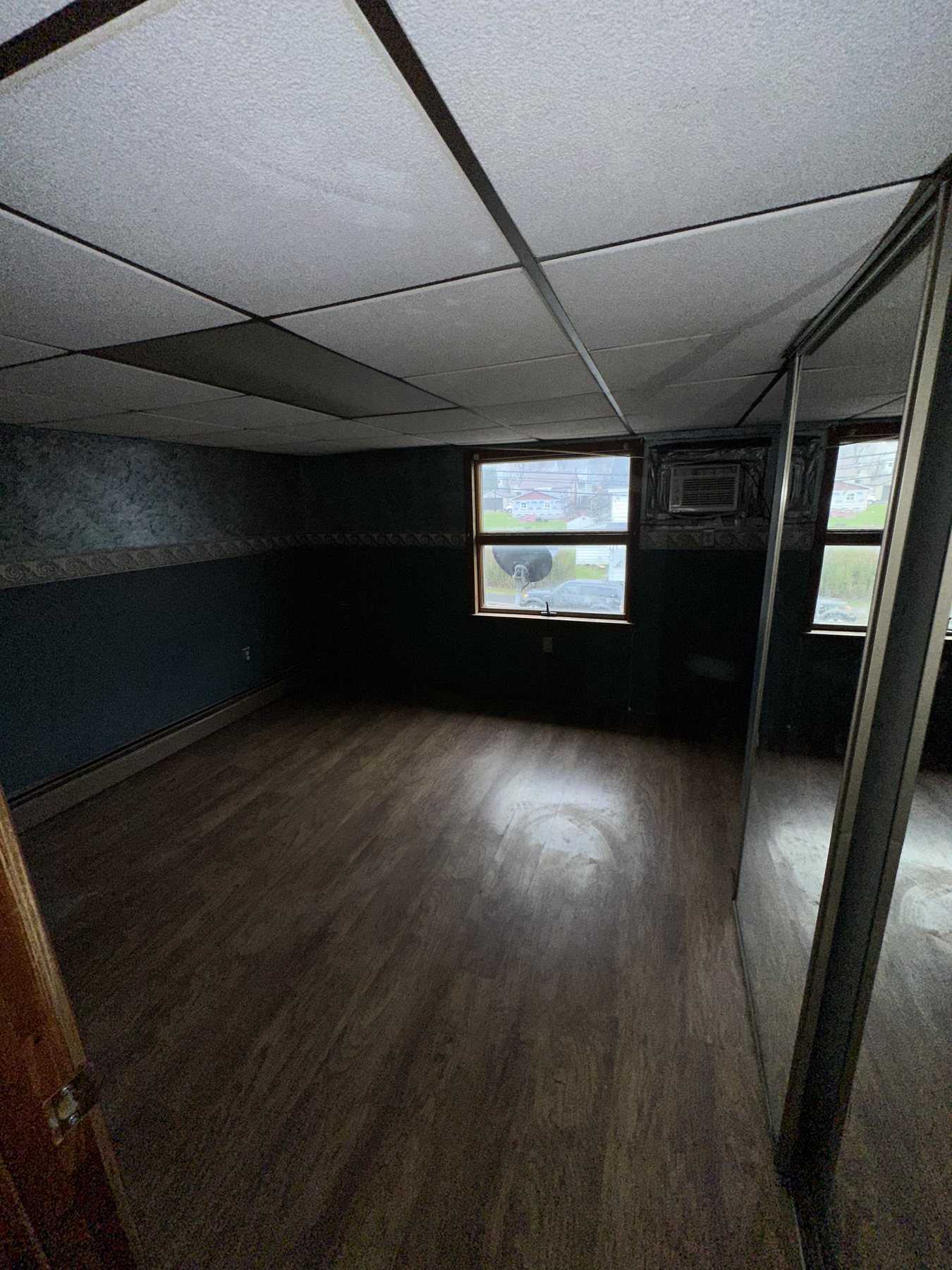 Before photo of main room with drop ceiling and older finishes in Bethlehem